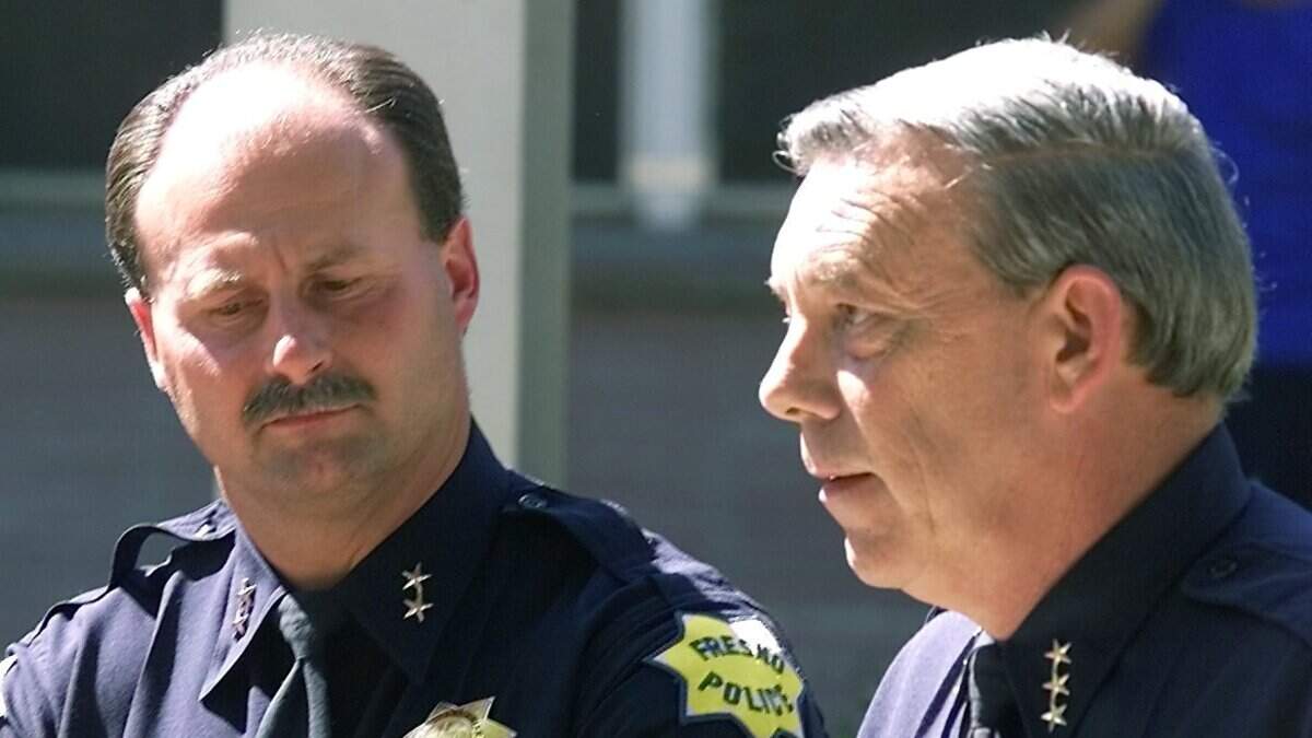 New Chief of Police Jerry Dyer and old Chief of Police Ed Winchester at the ceremony announcing the change in front of police headquarters on Wednesday afternoon July 18, 2001.